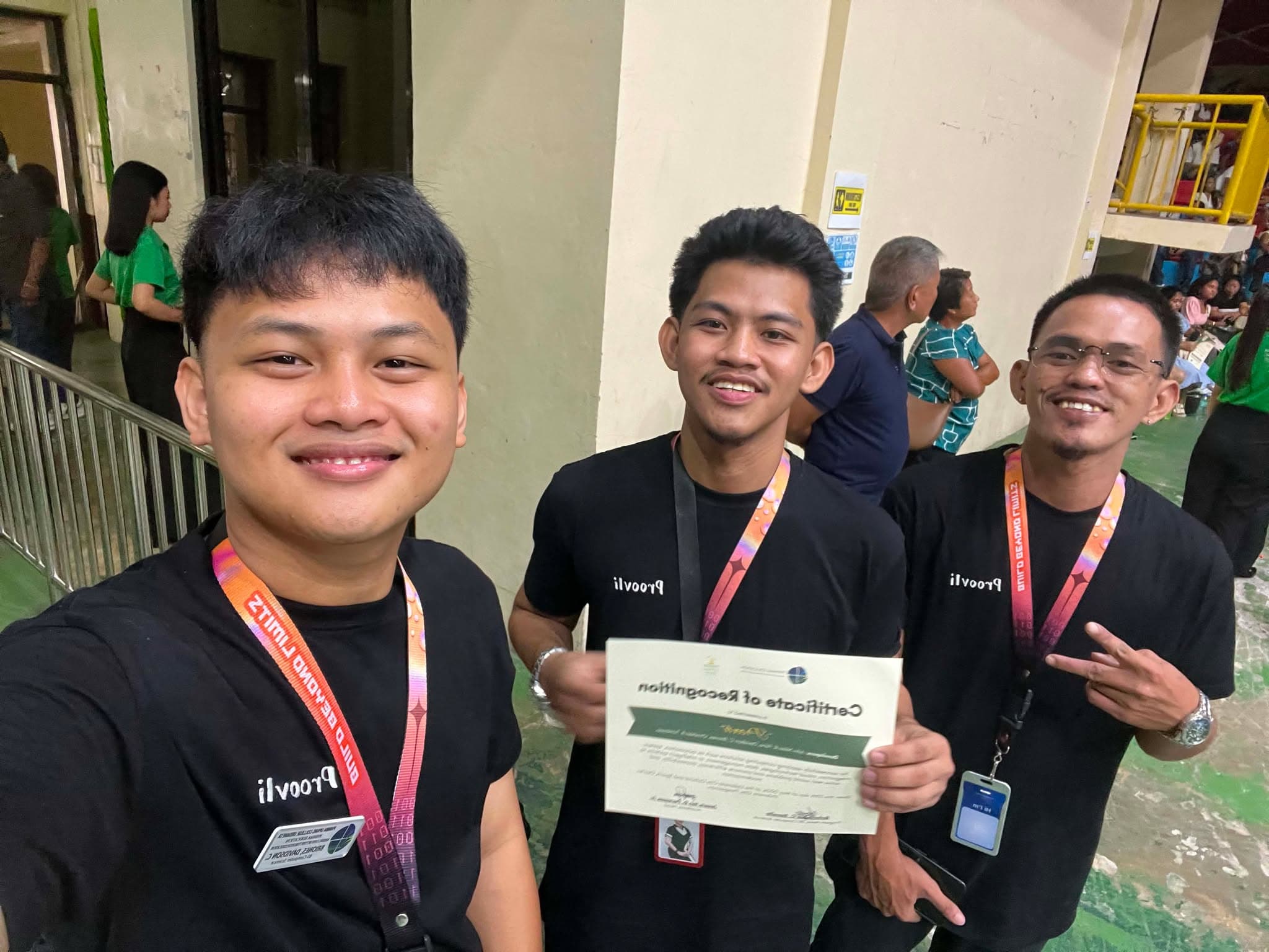 Proovli team selfie taken while holding the certificate of recognition.